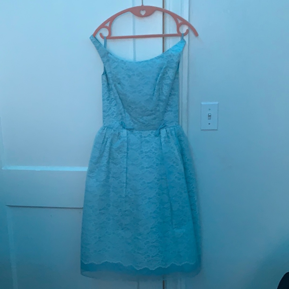 Blue sleeveless dress.